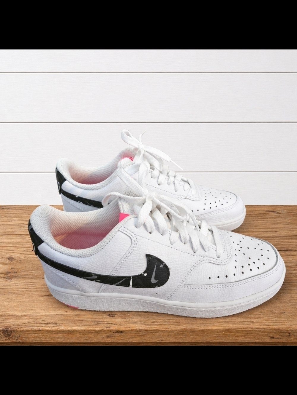 Nike White Low-Top Sneakers with Black Swoosh and Pink Liner